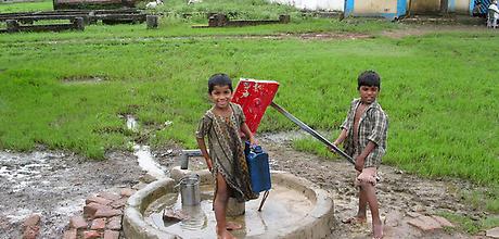 Boys at hand pump